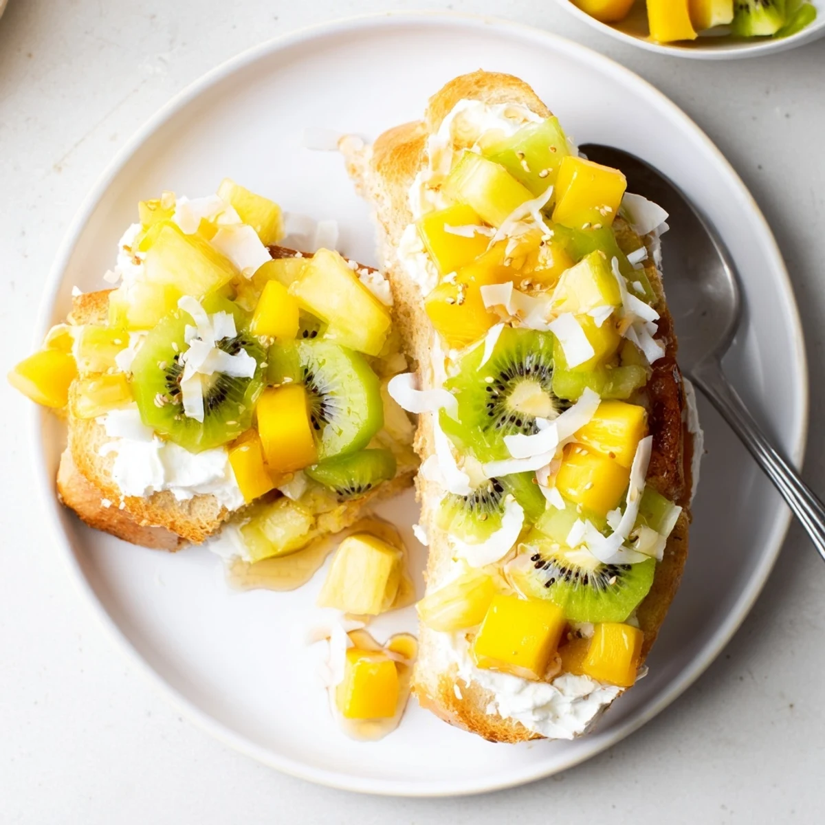 Delicious Yogurt-Custard Toast 2.0 topped with fresh tropical fruits and coconut.  