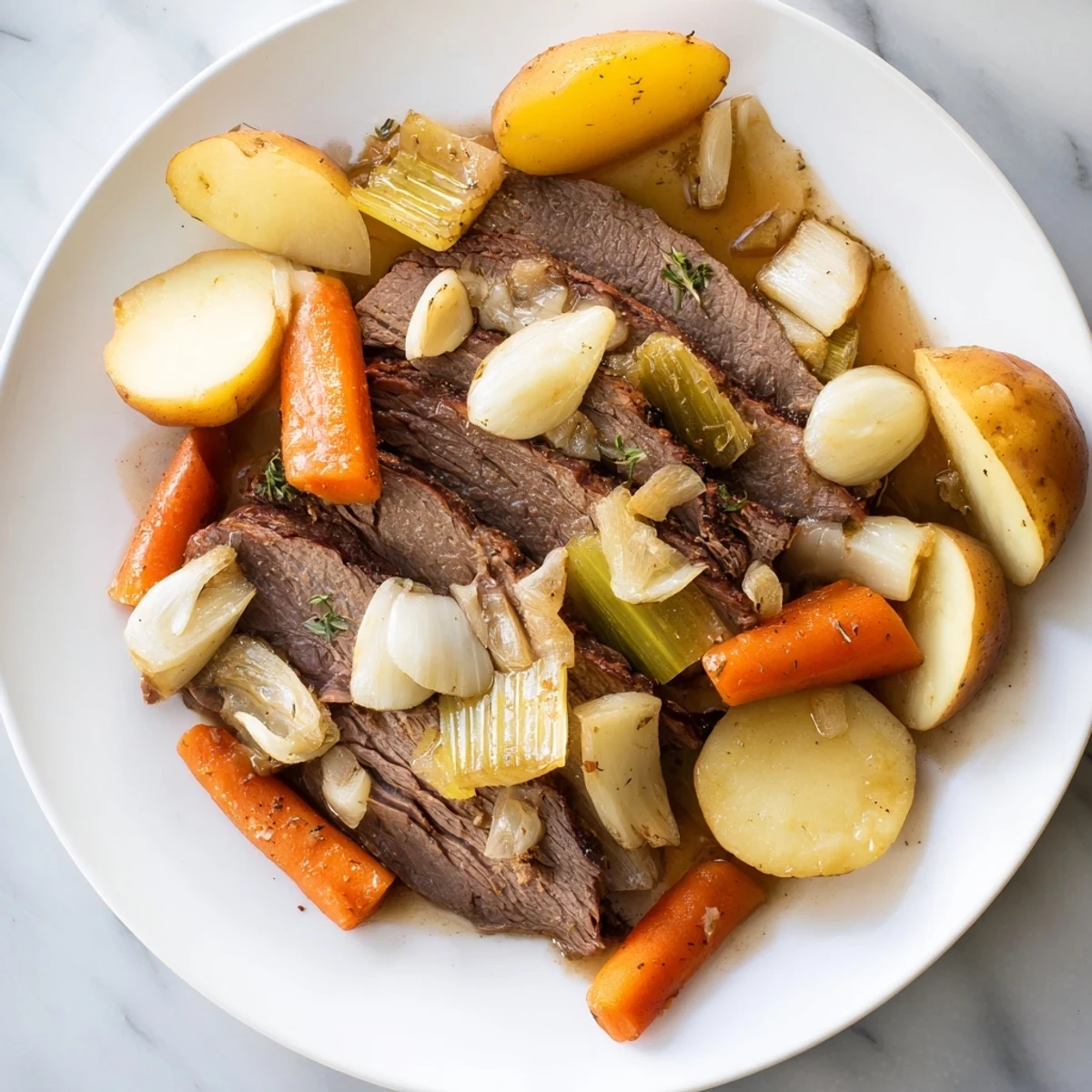 Hearty Sunday Pot Roast served with caramelized root vegetables and rich pan sauce.  