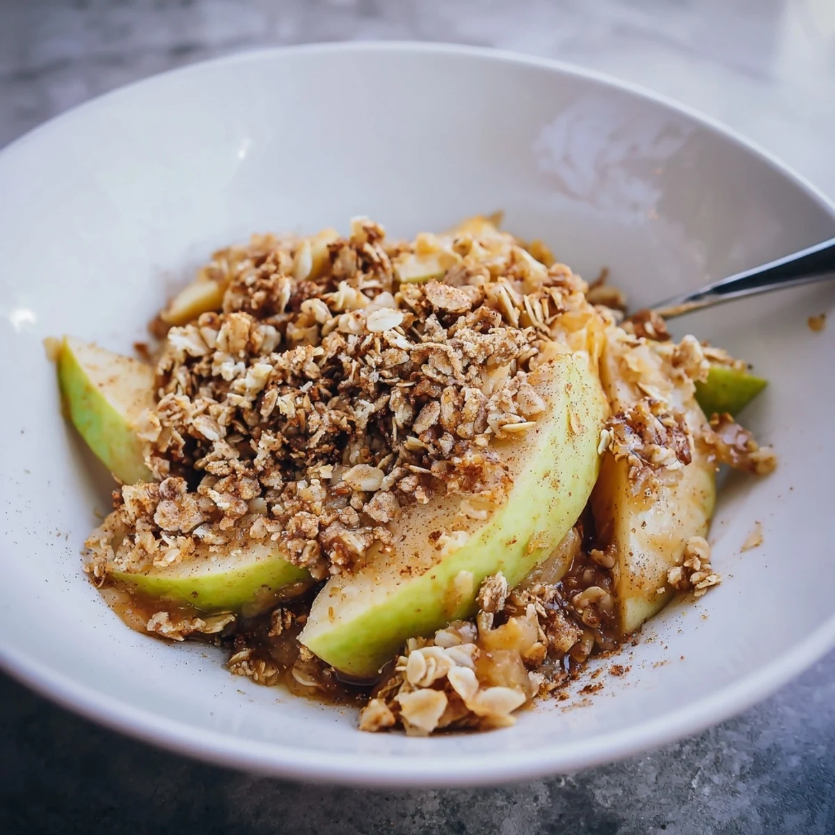 Golden-brown Best Apple Crisp bubbling, a comforting dessert with cinnamon-spiced apples.