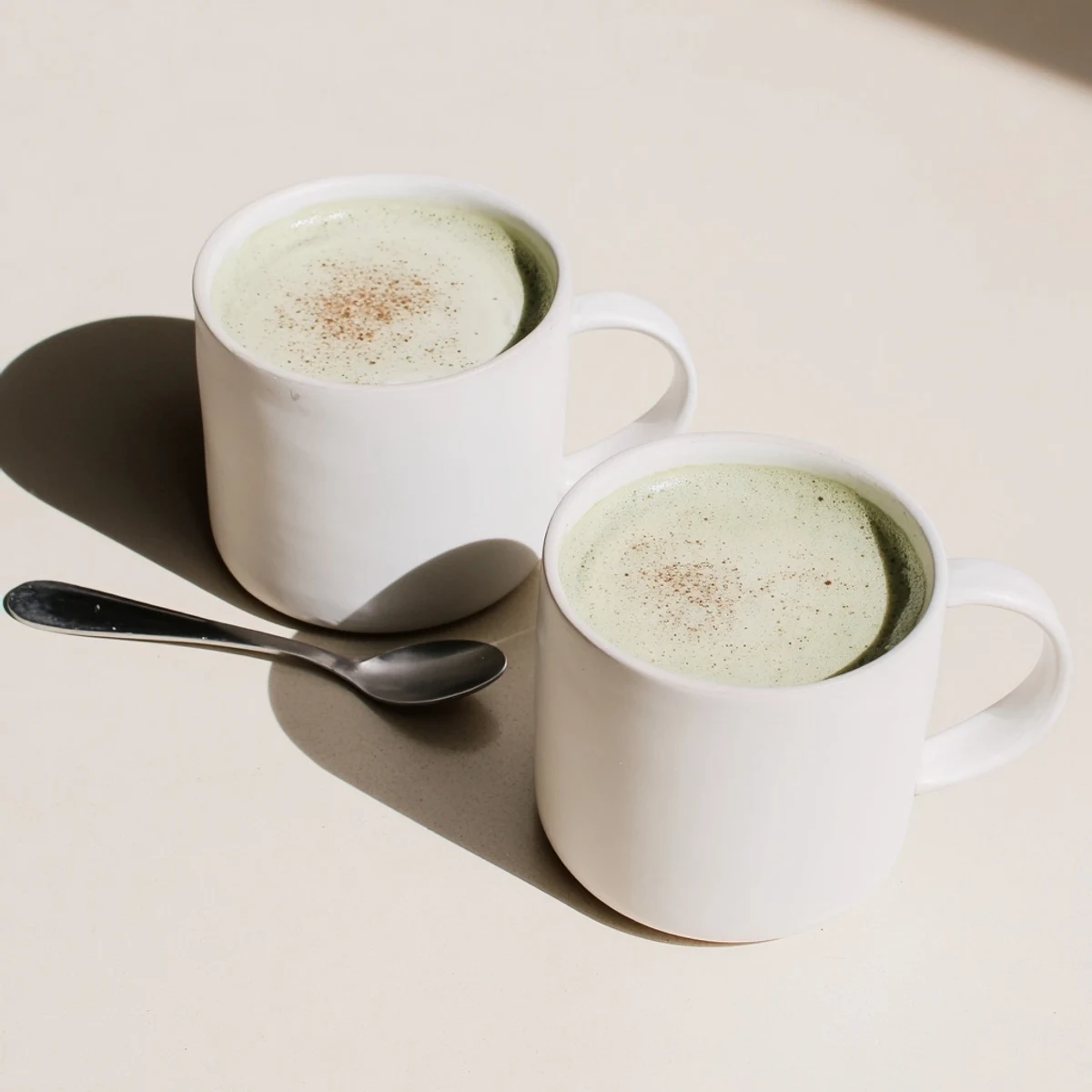 Frothy matcha latte, with cinnamon swirls, made with oat milk, maple syrup, and ready in minutes.