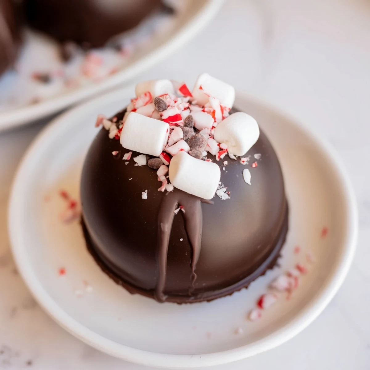 Vibrant toppings surround a homemade Hot Cocoa Bomb, offering delicious options for customizing flavors.