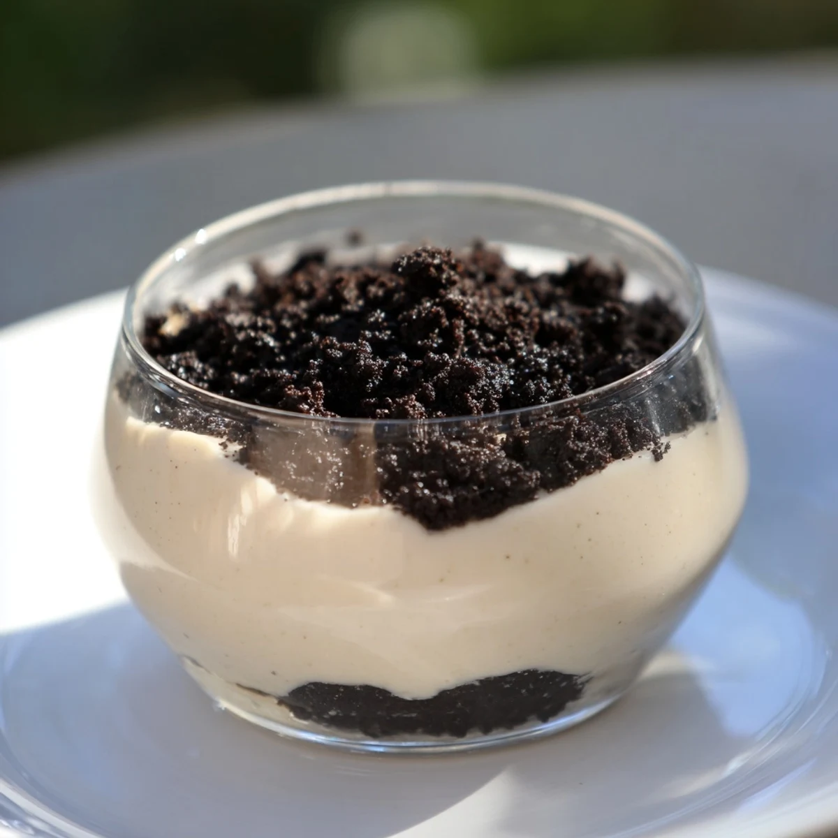 Enjoy a close-up image of the decadent Vanilla Pudding with Crushed Oreos, perfect for a treat.