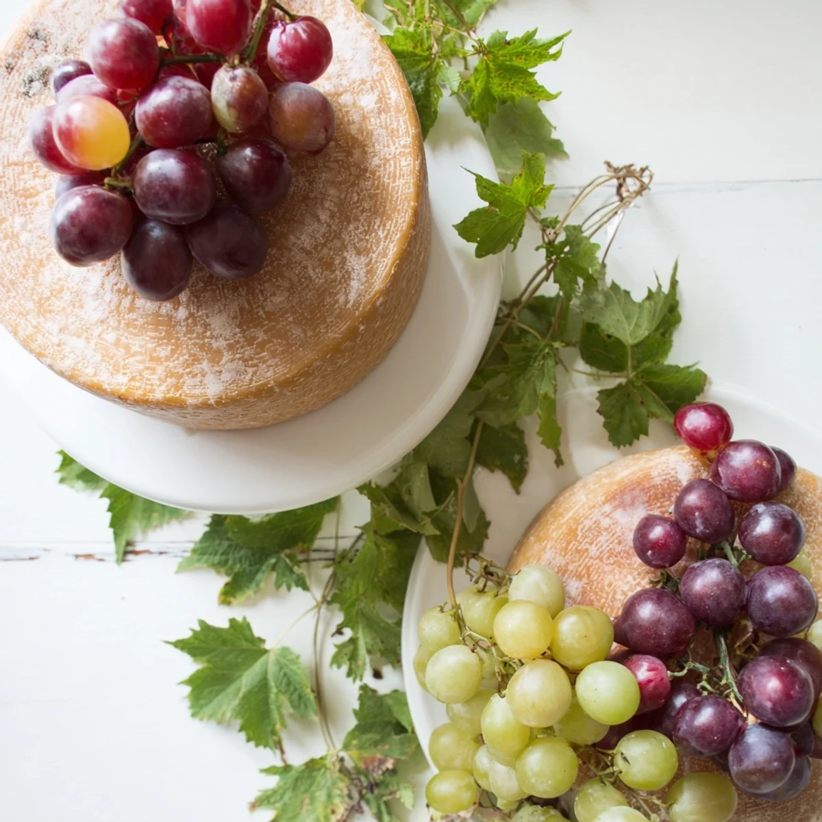 Rustic Vineyard cheese board arranged with fresh grapes and grapevines, ready to serve this appetizer.