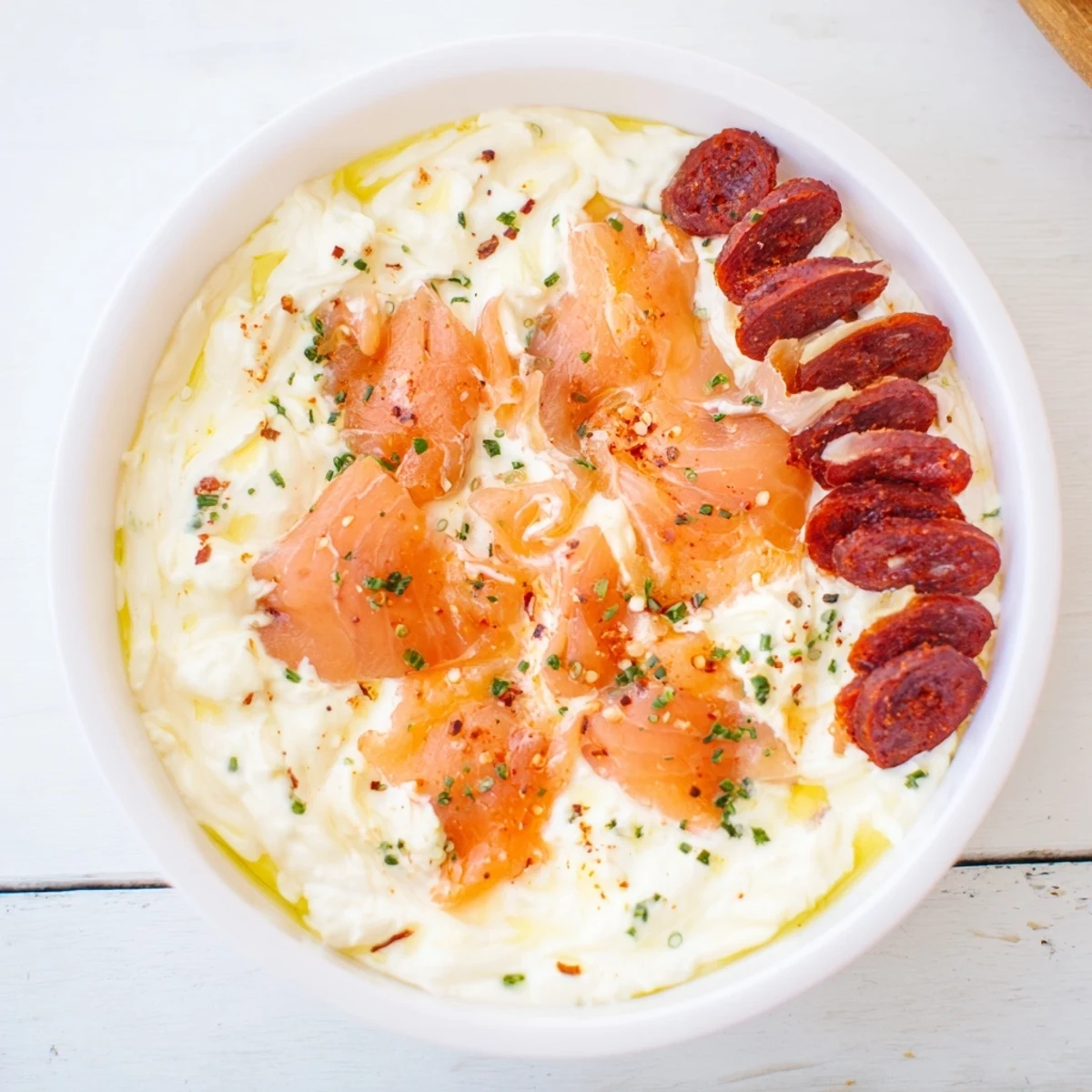 A beautifully arranged Compass Rose appetizer features diverse meats fanning outward from a dip.