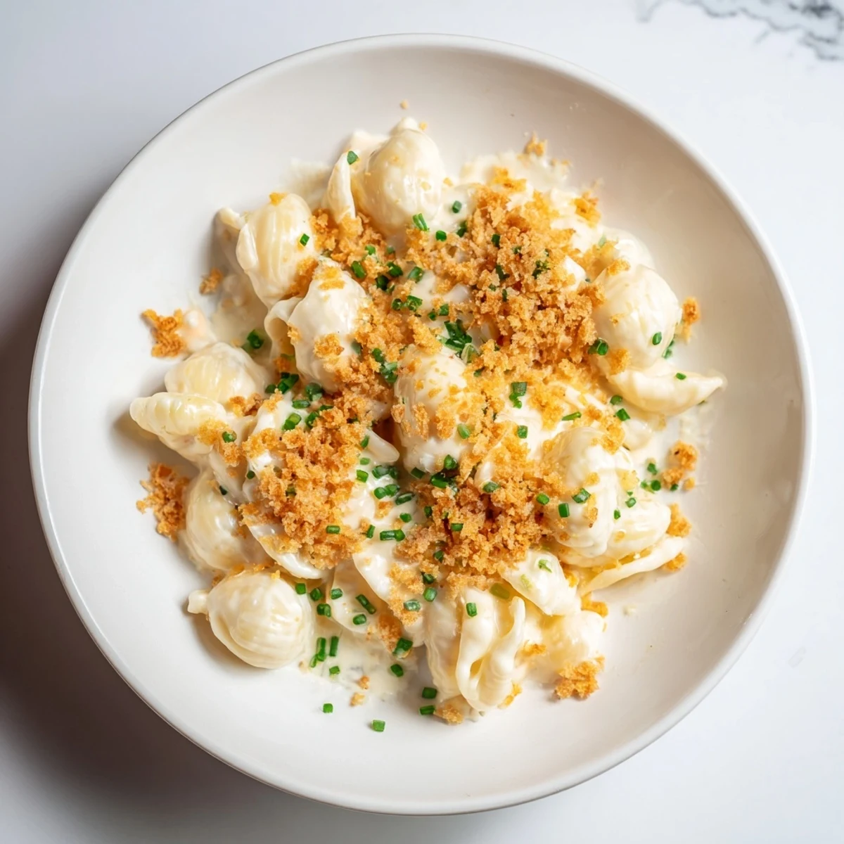 Warm, creamy Cottage Cheese Mac and Cheese topped with fresh chives, ready to eat.