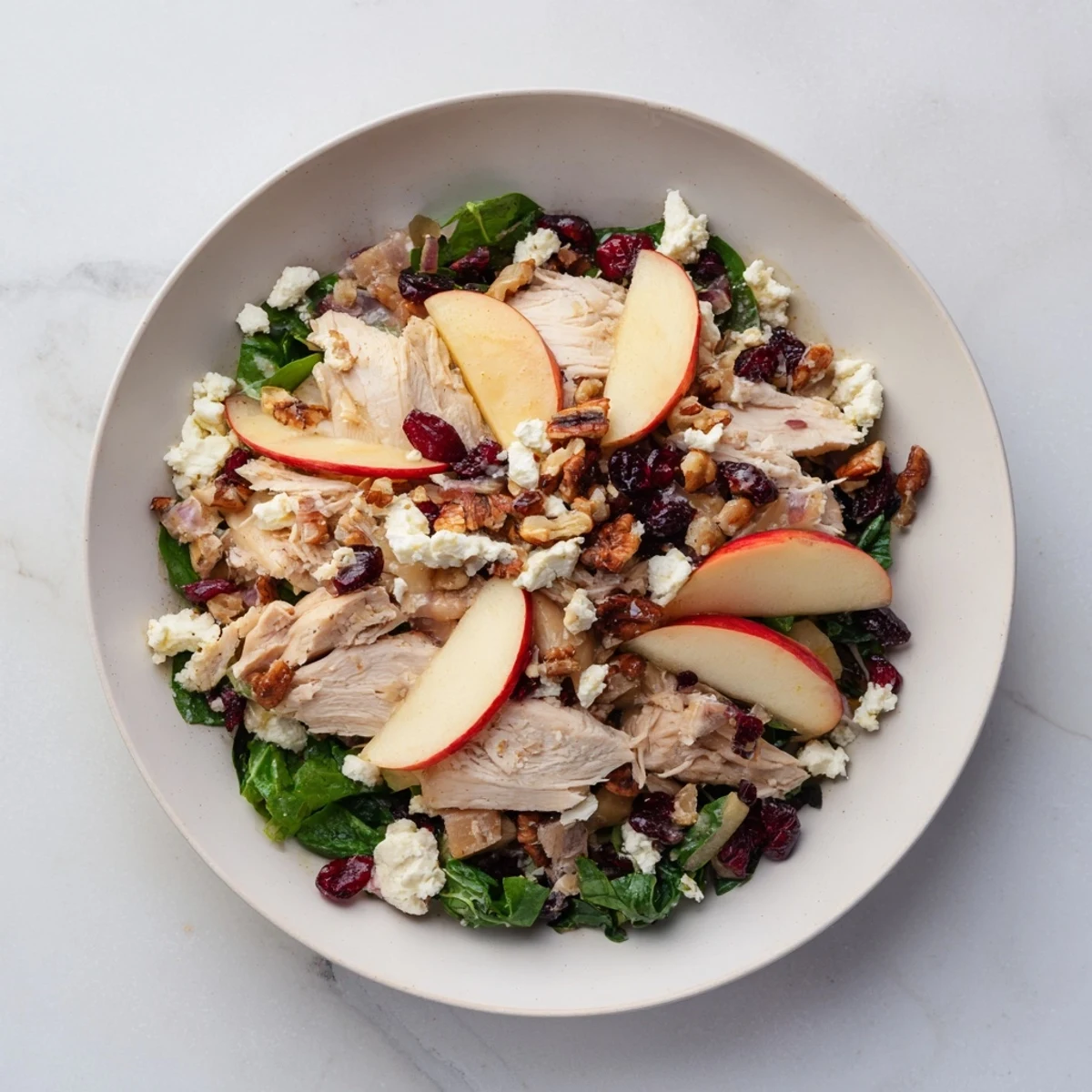 This gorgeous Chicken and Apple Winter Salad features glistening apple slices and tender chicken with pecans.