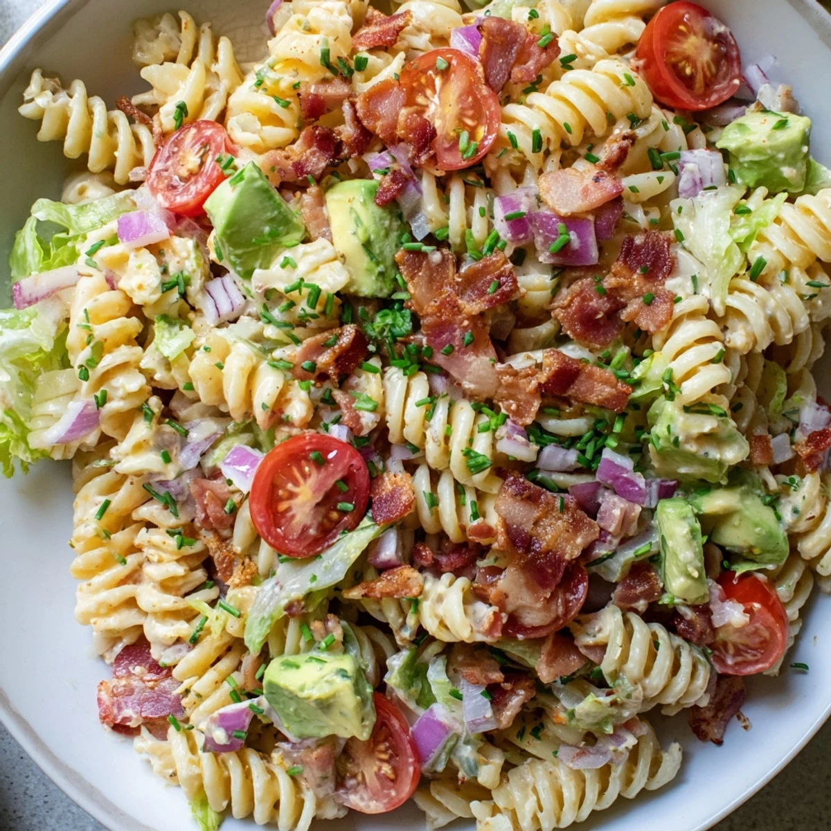 Creamy BLT Pasta Salad with a vibrant mix of ingredients, perfect for a summer picnic.