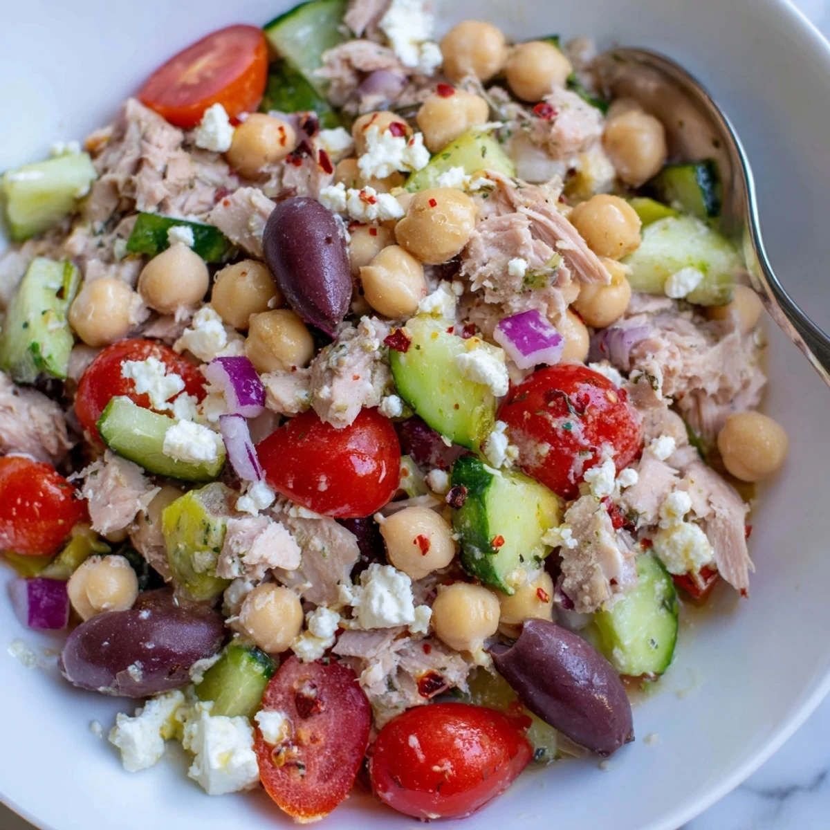 Homemade tuna chickpea salad; ready to enjoy, pictured with delicious ingredients and perfect for lunch.