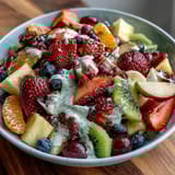 Spring Fruit Table Platter with Dipping Yogurt Sauce showcases a colorful arrangement of fresh berries, citrus, and tropical fruit paired with creamy honey-yogurt dip.