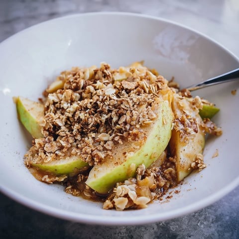 Golden-brown Best Apple Crisp bubbling, a comforting dessert with cinnamon-spiced apples.
