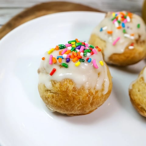Quick Christmas Biscuit Bombs displayed with a sweet glaze, warm and ready for a festive dessert.