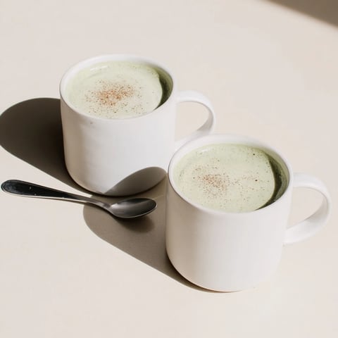 Frothy matcha latte, with cinnamon swirls, made with oat milk, maple syrup, and ready in minutes.