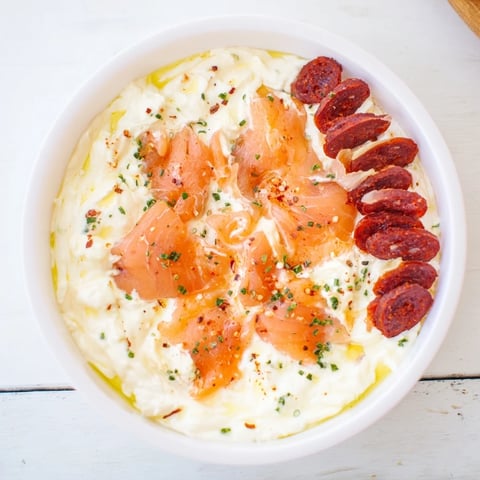 A beautifully arranged Compass Rose appetizer features diverse meats fanning outward from a dip.