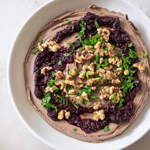 The Velvet Underground appetizer offers a rich and creamy pâté texture with jam swirls, showcasing a delicious flavor combination.