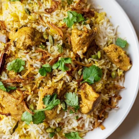 Steaming, fragrant Easy Chicken Biryani, a vibrant rice dish with tender chicken and warm spices.