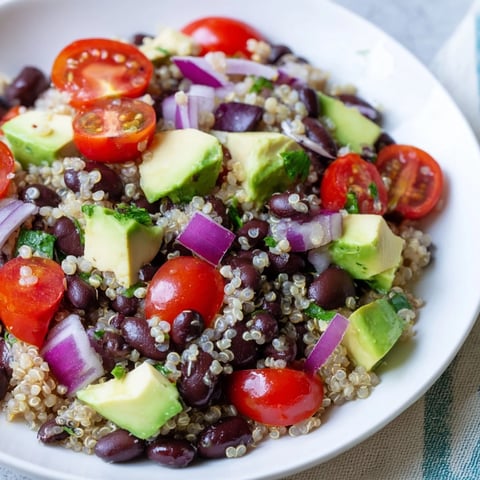 Vibrant Quinoa Black Bean Salad, a colorful mix of fresh veggies and zesty lime dressing.