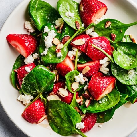 Vibrant Strawberry Spinach Salad with fresh strawberries, feta, and toasted almonds, ready to enjoy.