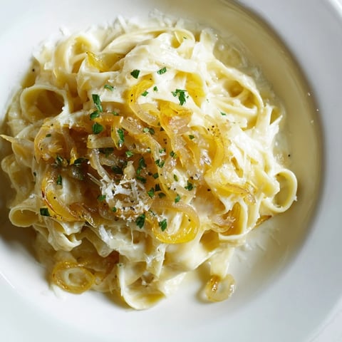 Golden caramelized onions and melted cheese atop the bubbling One-Pot French Onion Pasta, a hearty meal.