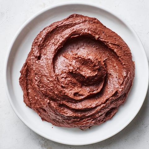 Golden-brown Emirati Al Madrooba, a creamy breakfast dish, served with warm, fluffy flatbread.