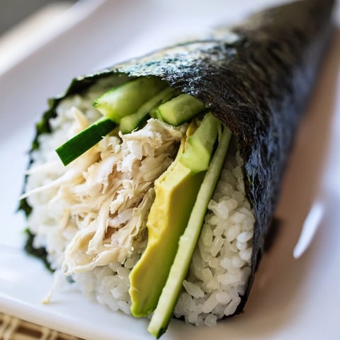 Fresh Sushi Rice Hand Rolls with creamy avocado, crisp cucumber, and shredded crab meat in nori cones.
