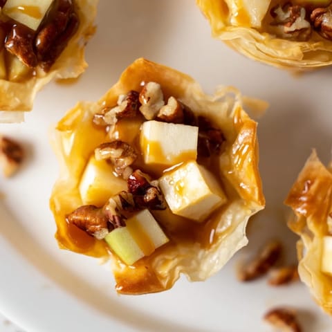 Buttery Caramel Apple Brie Bites served warm, topped with flaky sea salt.  