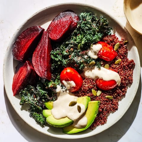 Imagine the earthy red beets and vibrant kale in this delicious Quinoa, Kale & Roasted Beet Bowl.