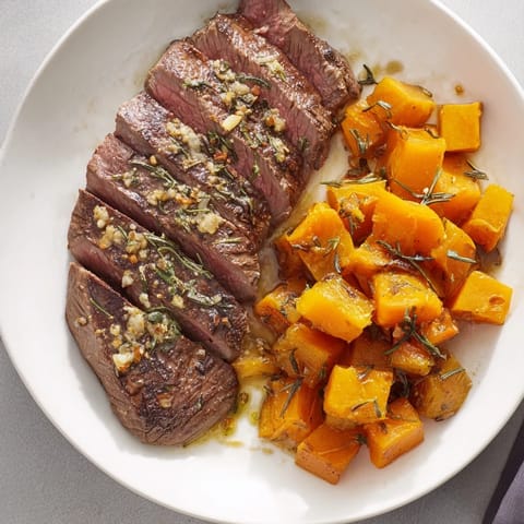 Golden-brown roasted butternut squash and savory steak star in these delicious bowls.