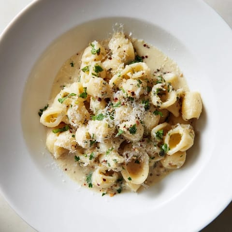 A warm bowl of creamy garlic ditalini pasta, ready for a comforting Italian-American dinner.