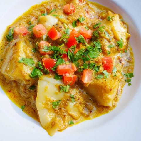 Bright, golden Bahraini Fish Curry with chunks of white fish in a creamy, flavorful sauce.