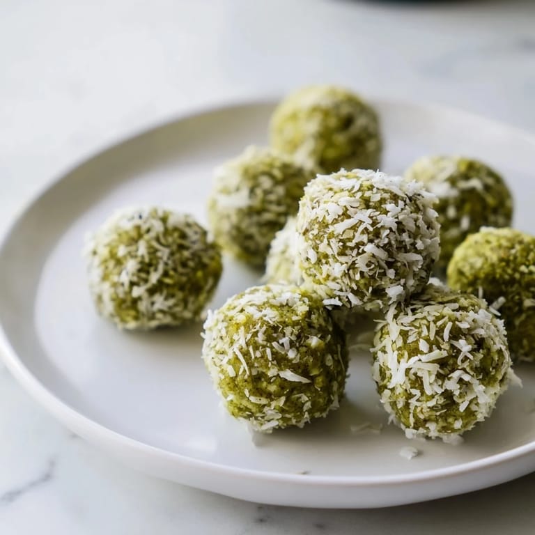 Imagine perfectly formed Coconut Matcha Snowball fat bombs; a delicious keto-friendly snack, ready to eat.