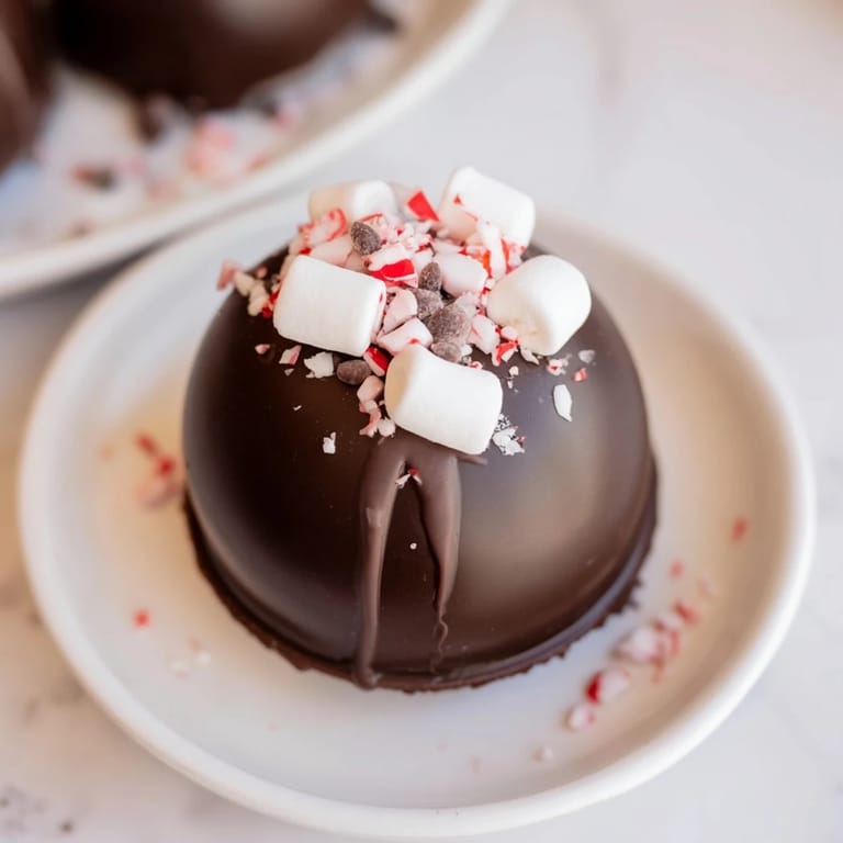 Vibrant toppings surround a homemade Hot Cocoa Bomb, offering delicious options for customizing flavors.