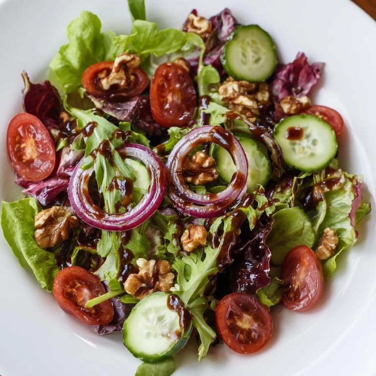 Enjoy a colorful bowl of Quick Balsamic Vinegar Salad: mixed greens, crisp veggies, and balsamic dressing.